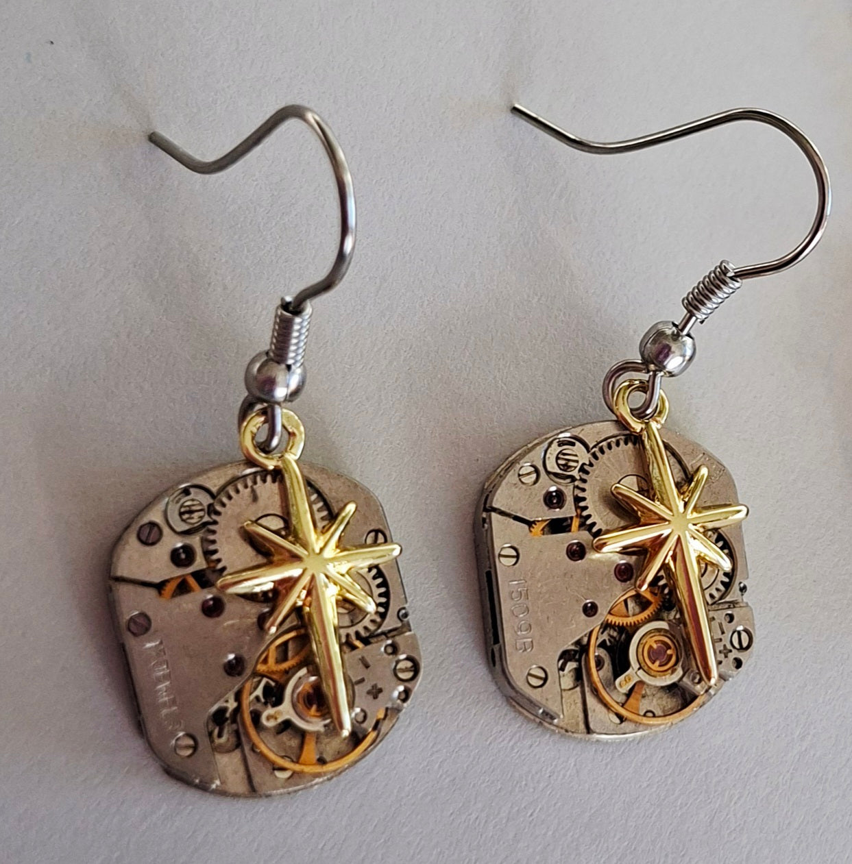Sean Rainey - Matariki collection - timepiece earrings with gold stars