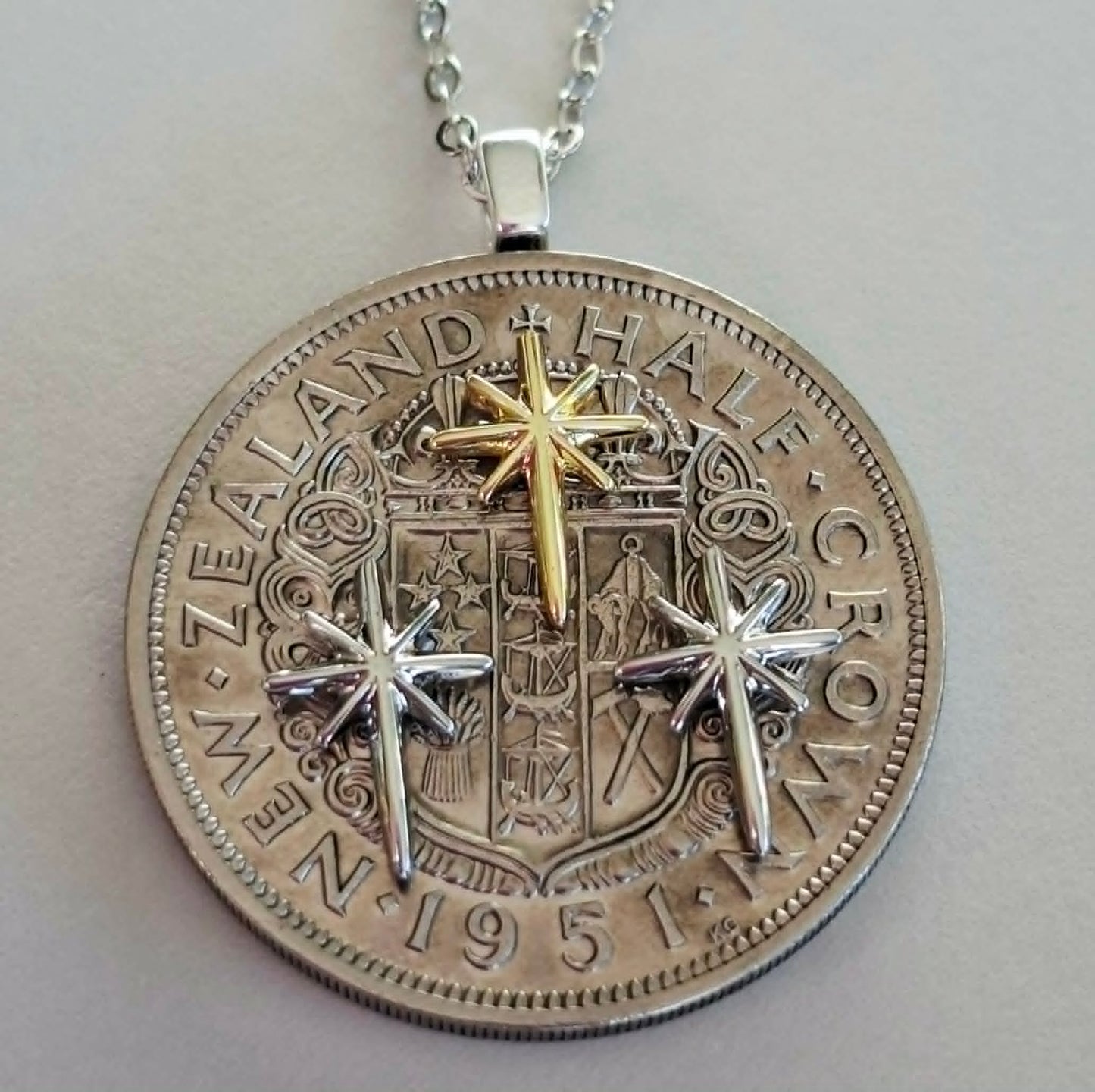 Sean Rainey - Matariki collection - Re-minted Half crown pendant with mixed metal stars